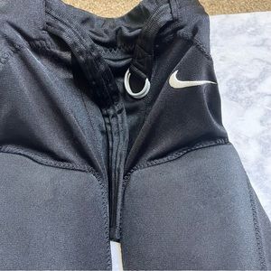 NIKE black padded football pants large